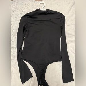 Black contour turtleneck bodysuit